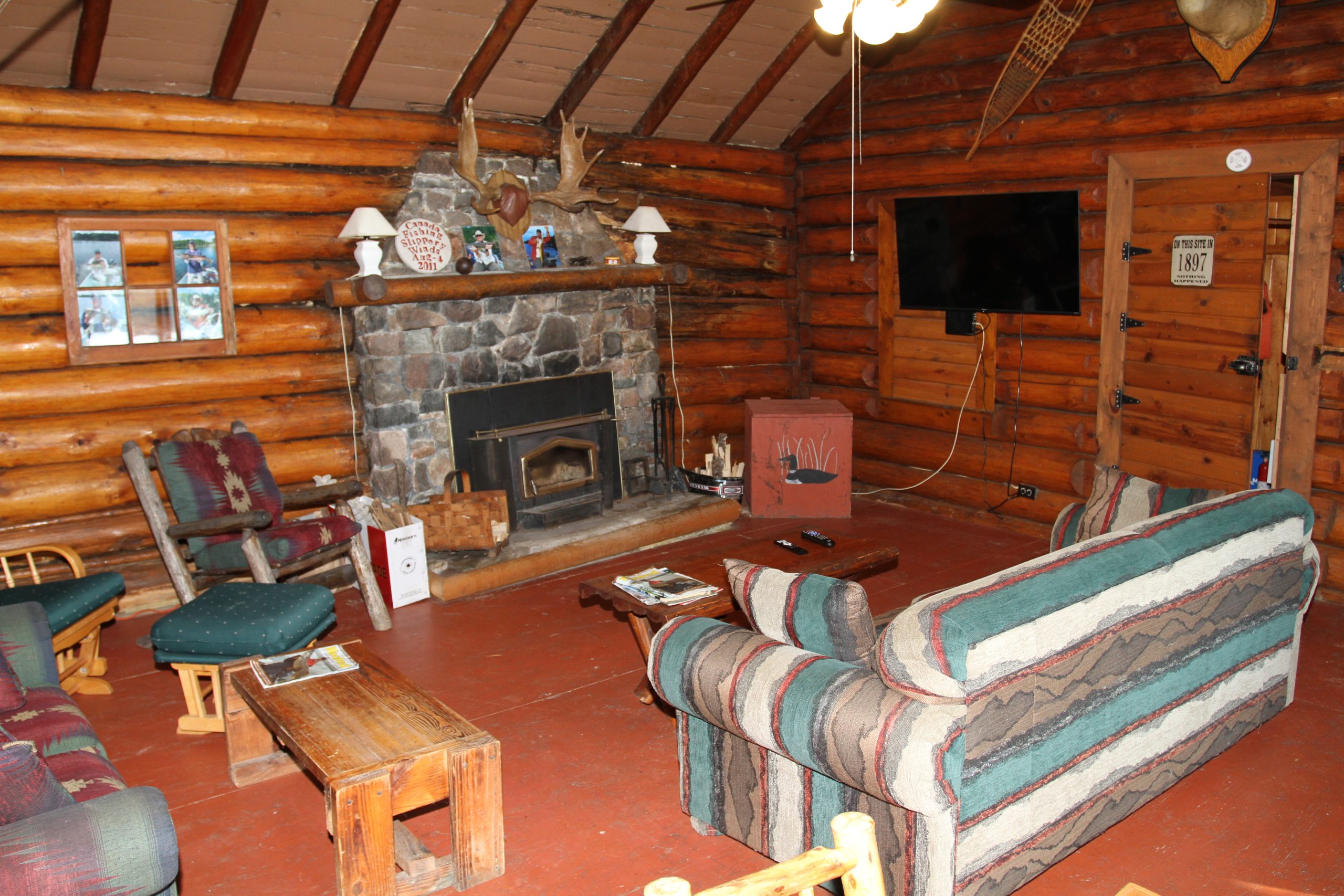 Slippery Winds lounge field stone fireplace